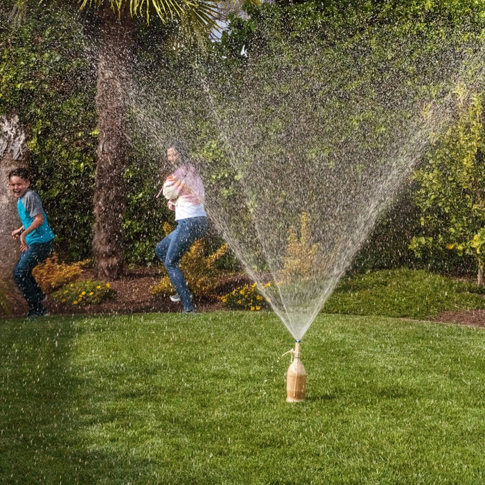 extreme geyser tube science experiment example with mom and child running from spraying pop 